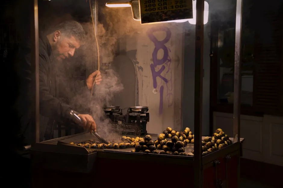 Vendeur tournant des marrons grillés sur une rôtissoire, marché de Rome